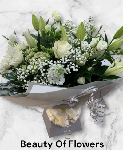 My Valentine Dream Flowers in Derby - My Valentine Dream is a Watered Hand Tied of mixed white and cream flowers and green foliage. Some times neutral shades create a classy and stunning impact. 

If you spend over £40.00 on your flowers you will receive a free box of chocolates