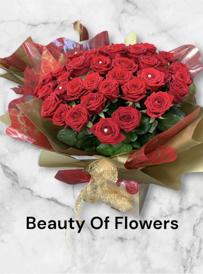 30 Red Rose Valentine Hand Tied - If you want to make an impact this bouquet will certainly do that. With 30 long stemmed Freedom Red Rose, which naturally have a very large head and then surrounded by mixed lush foliage. 

Spend over £40.00 on your flowers and receive a box of chocolates FREE. While stocks last.